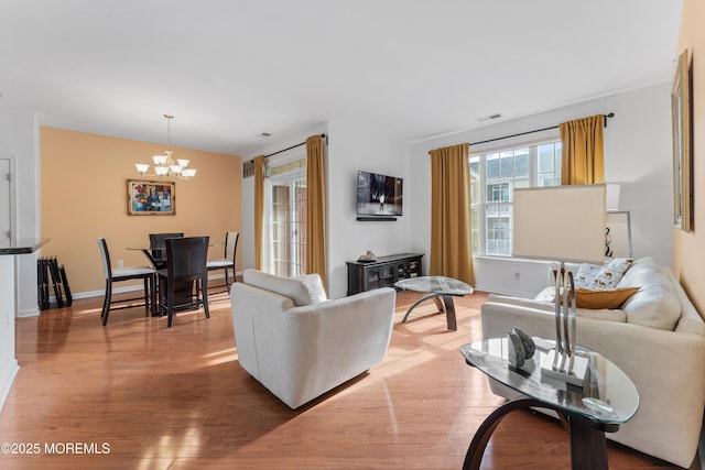 632 Sophee Ln, Lakewood, NJ 08701 - living room with a chandelier and wood finished floors