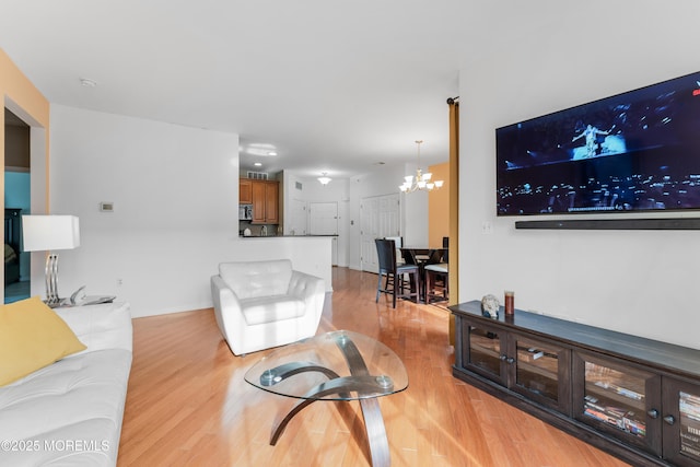 632 Sophee Ln, Lakewood, NJ 08701 - living room featuring a chandelier and light wood-type flooring