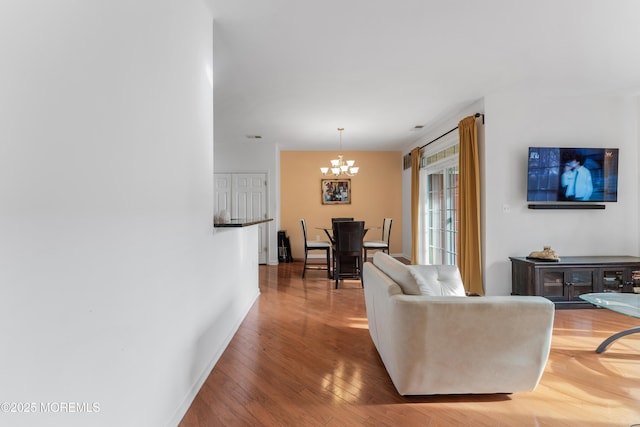 632 Sophee Ln, Lakewood, NJ 08701 - living area with a chandelier and wood finished floors
