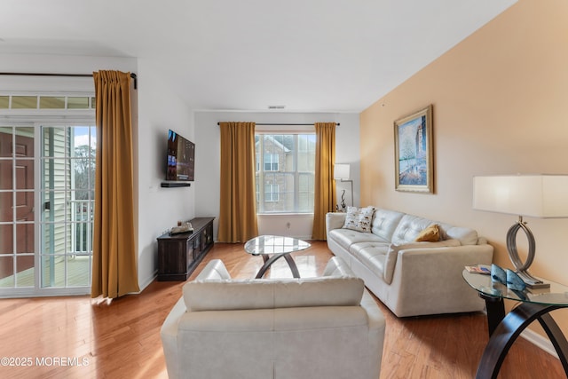 632 Sophee Ln, Lakewood, NJ 08701 - living area with plenty of natural light and light wood finished floors