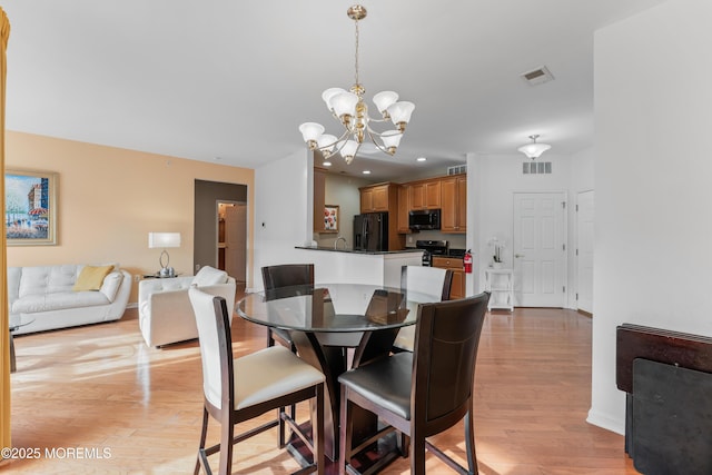 632 Sophee Ln, Lakewood, NJ 08701 - dining area featuring a chandelier, light wood finished floors, and recessed lighting