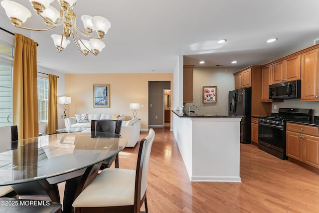 632 Sophee Ln, Lakewood, NJ 08701 - kitchen featuring black appliances, a chandelier, open floor plan, light wood-style floors, and recessed lighting
