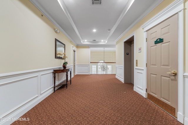 632 Sophee Ln, Lakewood, NJ 08701 - corridor with carpet floors, a decorative wall, a tray ceiling, ornamental molding, and a wainscoted wall
