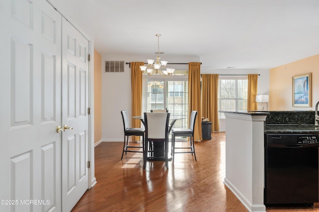 632 Sophee Ln, Lakewood, NJ 08701 - dining space with a chandelier and wood finished floors