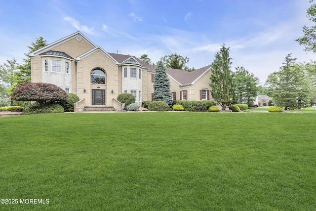 329 Valley View Cir, Freehold, NJ 07728 - view of front facade featuring a front lawn and brick siding