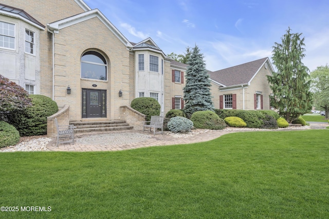 329 Valley View Cir, Freehold, NJ 07728 - view of front of house with brick siding and a front lawn
