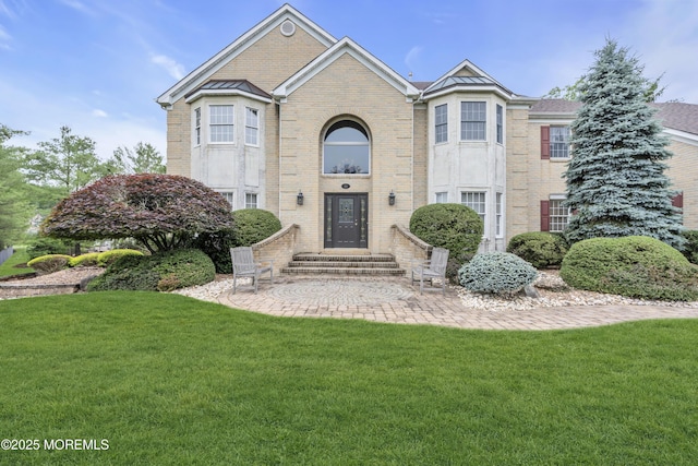 329 Valley View Cir, Freehold, NJ 07728 - traditional home featuring brick siding, a front yard, and entry steps