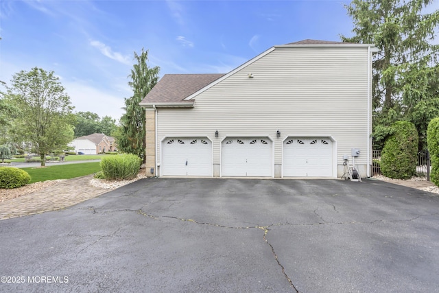 329 Valley View Cir, Freehold, NJ 07728 - view of home's exterior with driveway, a shingled roof, and a garage