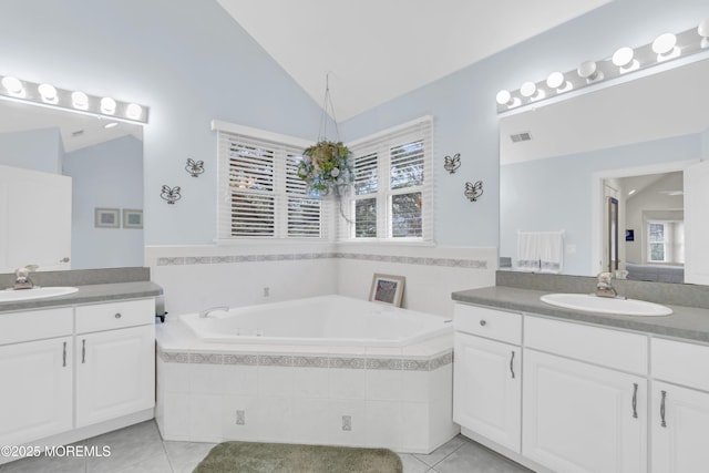 329 Valley View Cir, Freehold, NJ 07728 - bathroom with lofted ceiling, tile patterned flooring, two vanities, and a garden tub