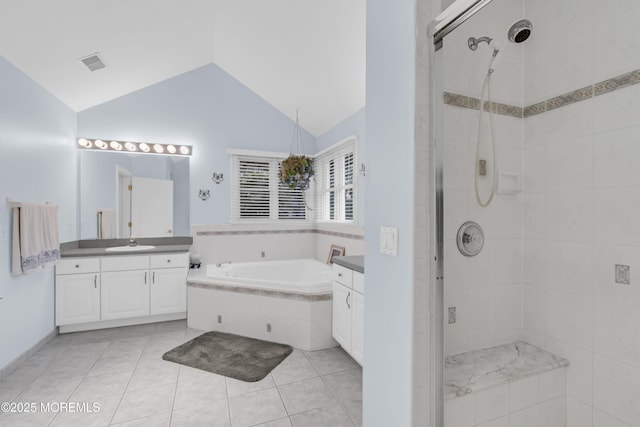 329 Valley View Cir, Freehold, NJ 07728 - full bathroom featuring vanity, vaulted ceiling, a garden tub, a shower stall, and tile patterned floors