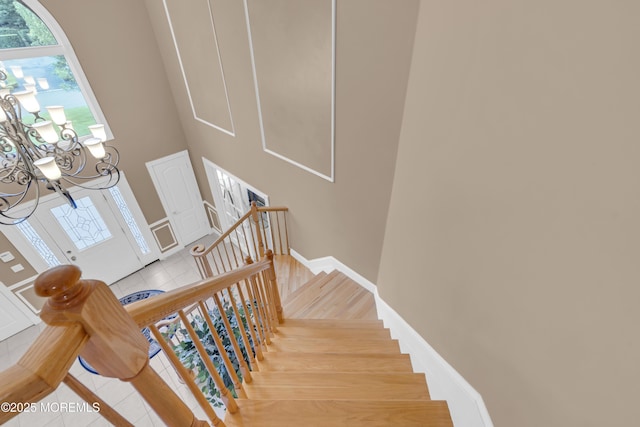 329 Valley View Cir, Freehold, NJ 07728 - stairs with a chandelier and tile patterned floors