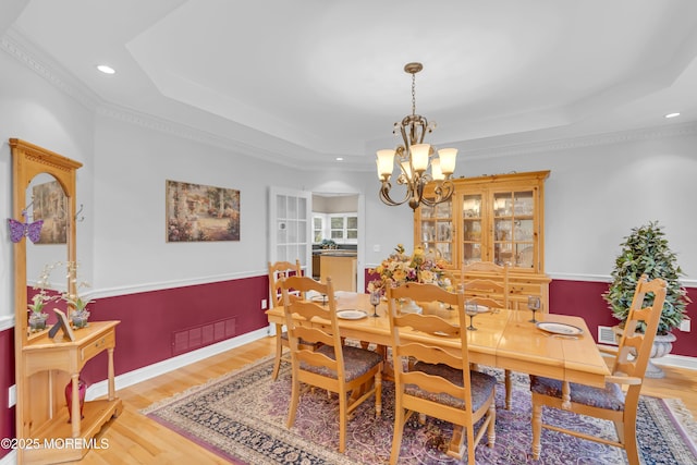 329 Valley View Cir, Freehold, NJ 07728 - dining space featuring a raised ceiling, a chandelier, light wood finished floors, recessed lighting, and crown molding