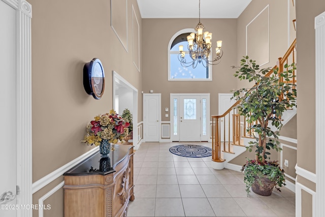 329 Valley View Cir, Freehold, NJ 07728 - foyer featuring a chandelier, stairs, a high ceiling, and light tile patterned floors
