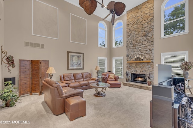 329 Valley View Cir, Freehold, NJ 07728 - carpeted living room featuring a towering ceiling, a fireplace, and ceiling fan