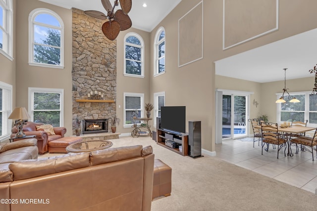 329 Valley View Cir, Freehold, NJ 07728 - living area with a towering ceiling, ceiling fan, light colored carpet, healthy amount of natural light, and a fireplace