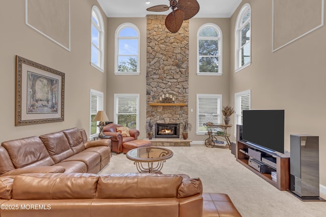 329 Valley View Cir, Freehold, NJ 07728 - living area with healthy amount of natural light, a ceiling fan, carpet, a towering ceiling, and a fireplace