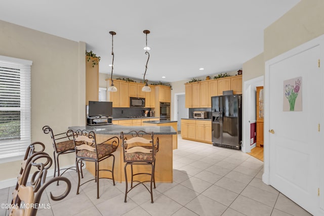 329 Valley View Cir, Freehold, NJ 07728 - kitchen with black appliances, light brown cabinetry, a peninsula, a breakfast bar area, and recessed lighting