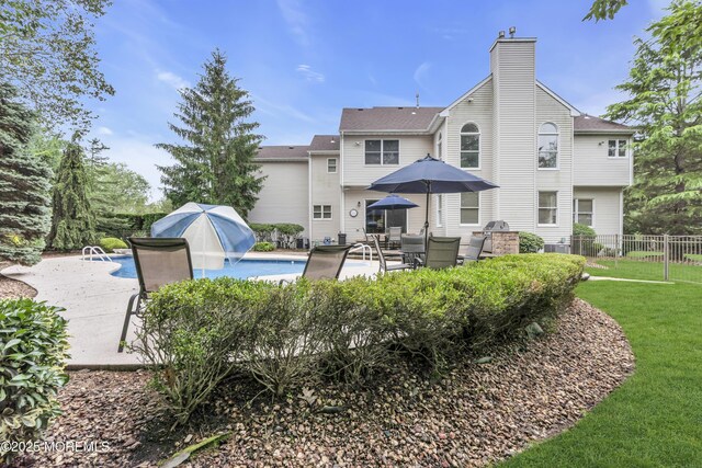 329 Valley View Cir, Freehold, NJ 07728 - back of property featuring a patio area and a chimney