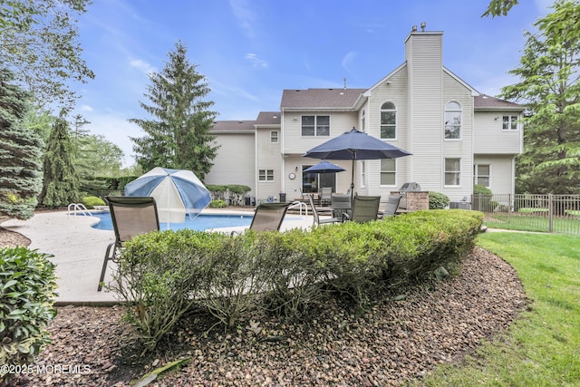329 Valley View Cir, Freehold, NJ 07728 - back of property with a patio area and a chimney