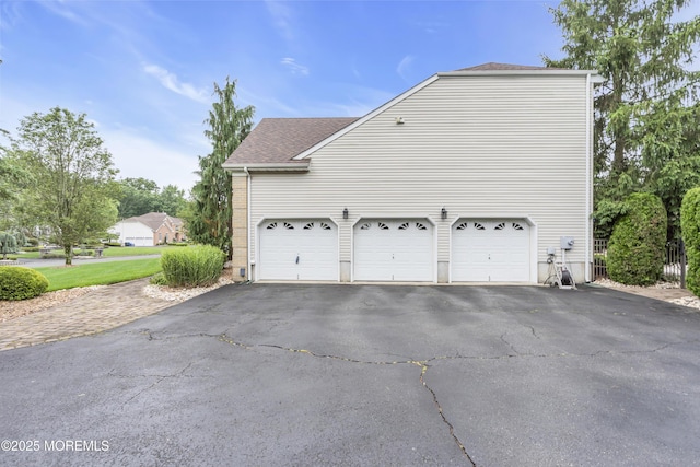 329 Valley View Cir, Freehold, NJ 07728 - view of side of property featuring asphalt driveway and a shingled roof