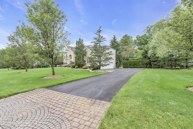 329 Valley View Cir, Freehold, NJ 07728 - obstructed view of property featuring a front yard, a garage, and driveway