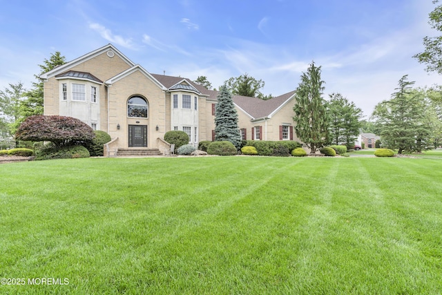 329 Valley View Cir, Freehold, NJ 07728 - view of front facade with a front lawn and brick siding