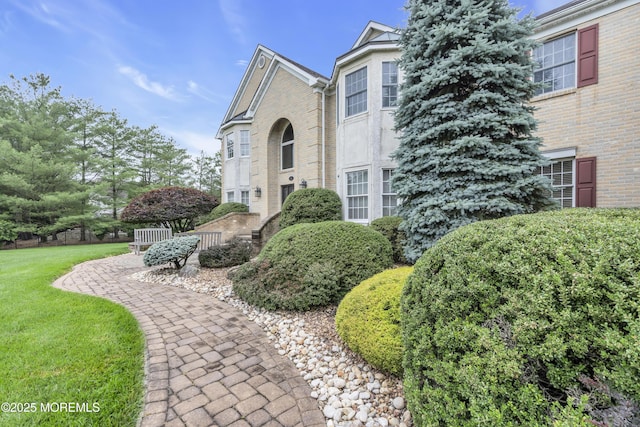 329 Valley View Cir, Freehold, NJ 07728 - view of home's exterior with brick siding and a yard