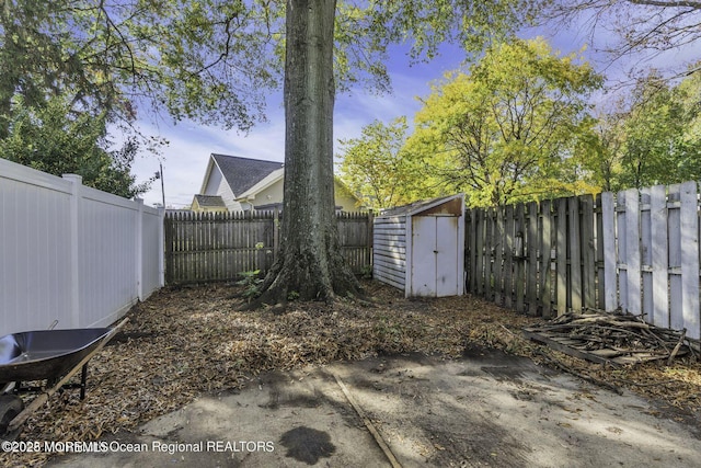 74 Fieldcrest Way, Hazlet, NJ 07730 - fenced backyard featuring a storage unit and a patio area