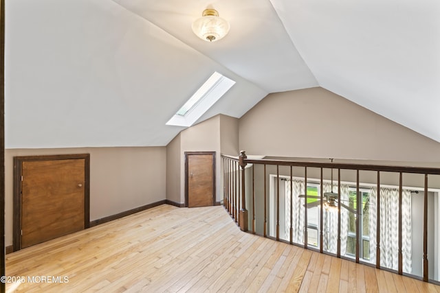 76 9th St, Belford, NJ 07718 - bonus room with a skylight, vaulted ceiling, and hardwood / wood-style floors