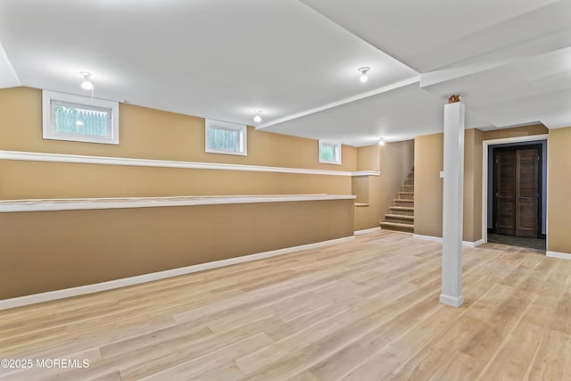 76 9th St, Belford, NJ 07718 - below grade area with wood finished floors and stairway