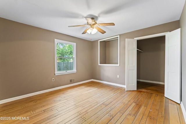 76 9th St, Belford, NJ 07718 - unfurnished bedroom with light wood-style flooring and ceiling fan