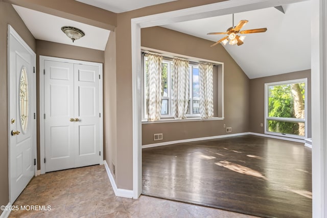 76 9th St, Belford, NJ 07718 - foyer with vaulted ceiling, a ceiling fan, and wood finished floors