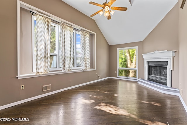 76 9th St, Belford, NJ 07718 - unfurnished living room featuring vaulted ceiling, ceiling fan, wood finished floors, and a fireplace with raised hearth