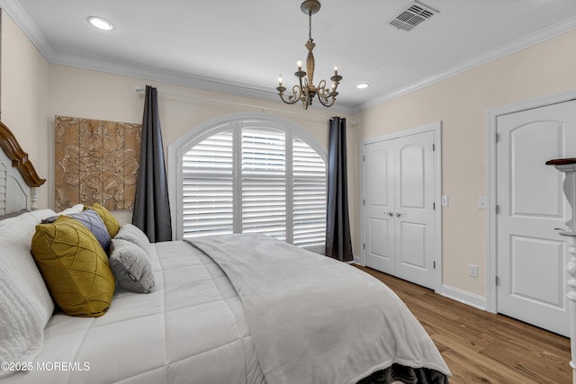 14 Seadrift Ave, Highlands, NJ 07732 - bedroom with a chandelier, ornamental molding, wood finished floors, recessed lighting, and a closet