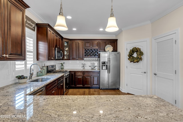14 Seadrift Ave, Highlands, NJ 07732 - kitchen with appliances with stainless steel finishes, tasteful backsplash, ornamental molding, light stone countertops, and glass insert cabinets