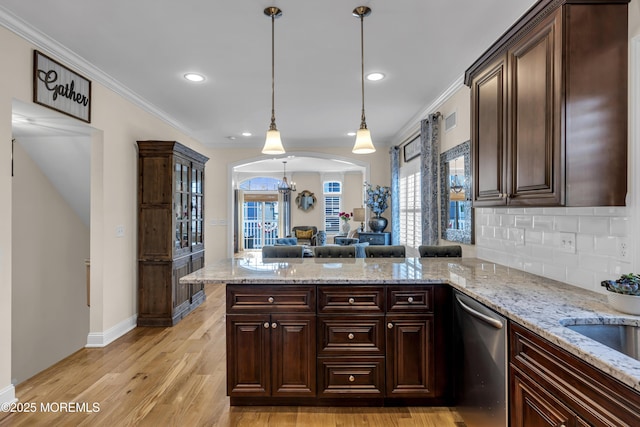 14 Seadrift Ave, Highlands, NJ 07732 - kitchen with stainless steel dishwasher, arched walkways, a peninsula, dark brown cabinets, and ornamental molding