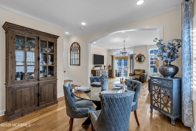 14 Seadrift Ave, Highlands, NJ 07732 - dining room featuring arched walkways, a chandelier, light wood-style floors, recessed lighting, and crown molding