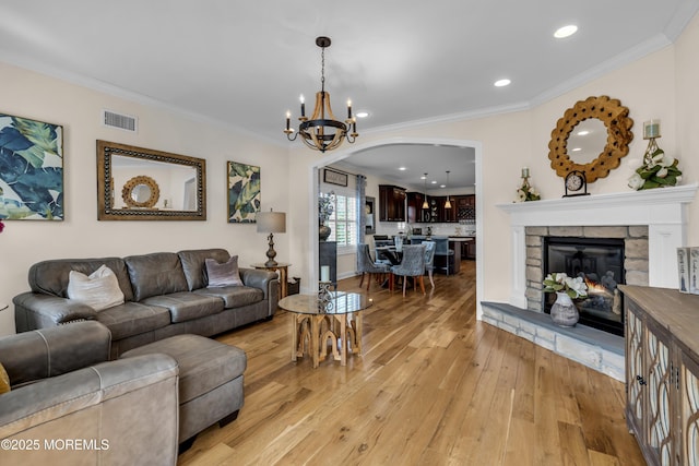 14 Seadrift Ave, Highlands, NJ 07732 - living room with arched walkways, light wood finished floors, recessed lighting, crown molding, and a chandelier
