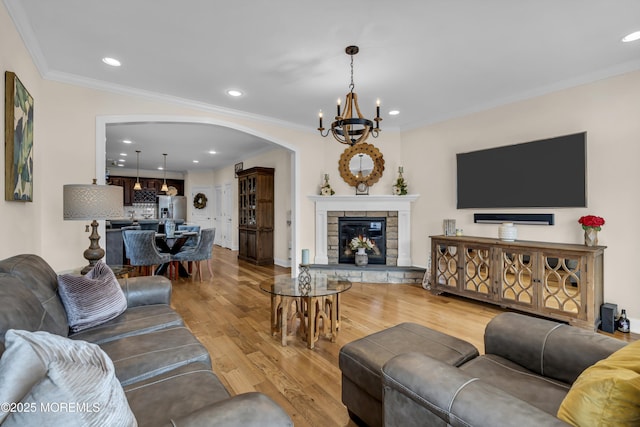 14 Seadrift Ave, Highlands, NJ 07732 - living room featuring arched walkways, a chandelier, ornamental molding, light wood finished floors, and recessed lighting