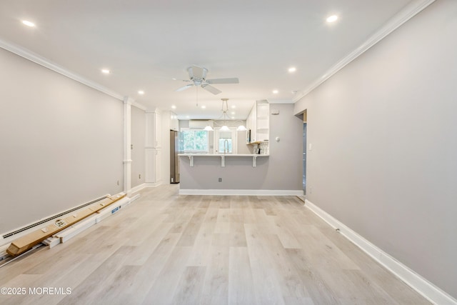 6 S Heron St Unit A, Manchester, NJ 08759 - unfurnished living room with a ceiling fan, ornamental molding, recessed lighting, light wood-style floors, and baseboard heating
