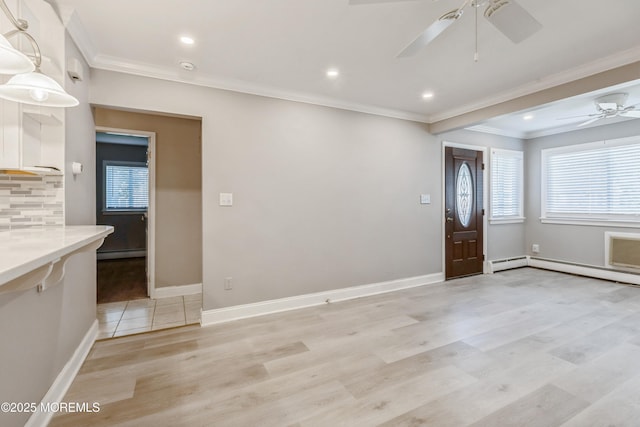 6 S Heron St Unit A, Manchester, NJ 08759 - foyer with a ceiling fan, light wood-type flooring, ornamental molding, baseboard heating, and recessed lighting