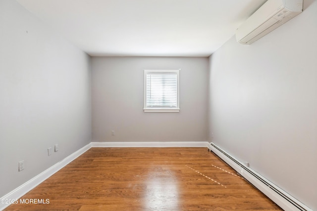 6 S Heron St Unit A, Manchester, NJ 08759 - empty room featuring baseboard heating, an AC wall unit, and wood finished floors