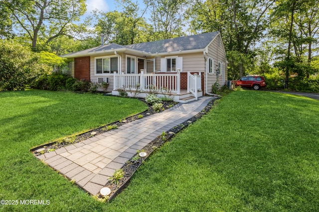 6 S Heron St Unit A, Manchester, NJ 08759 - ranch-style house featuring covered porch, a front lawn, and a shingled roof