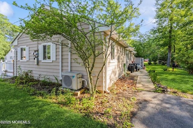 6 S Heron St Unit A, Manchester, NJ 08759 - view of side of home with a cooling unit and a yard