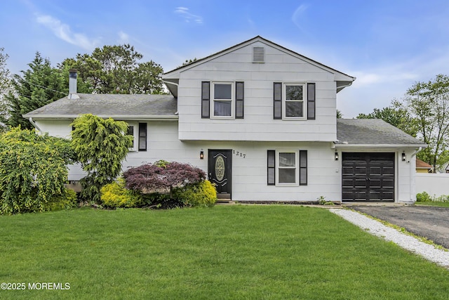 1217 Madison Ave, Toms River, NJ 08757 - split level home featuring a garage, roof with shingles, asphalt driveway, and a front lawn