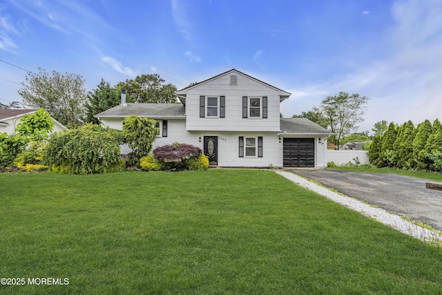 1217 Madison Ave, Toms River, NJ 08757 - tri-level home featuring an attached garage, asphalt driveway, and roof with shingles