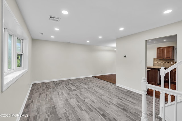 1217 Madison Ave, Toms River, NJ 08757 - spare room with light wood-type flooring, recessed lighting, and stairs