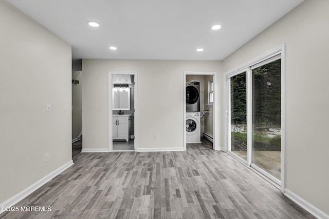 1217 Madison Ave, Toms River, NJ 08757 - unfurnished living room with stacked washer and clothes dryer, wood finished floors, and recessed lighting