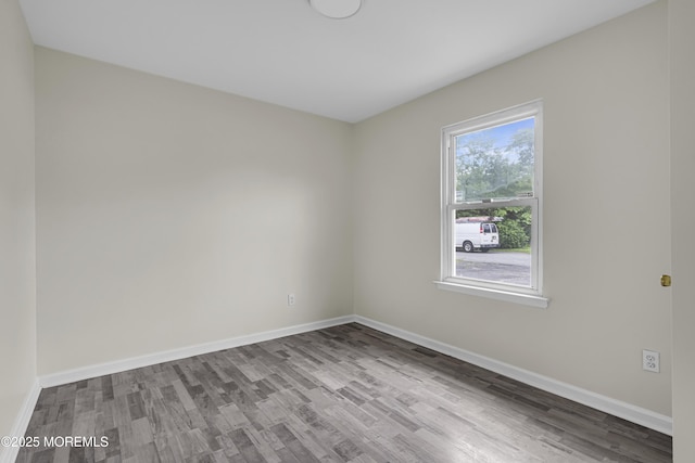 1217 Madison Ave, Toms River, NJ 08757 - spare room featuring wood finished floors and baseboards