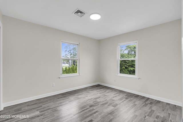 1217 Madison Ave, Toms River, NJ 08757 - unfurnished room featuring wood finished floors and healthy amount of natural light